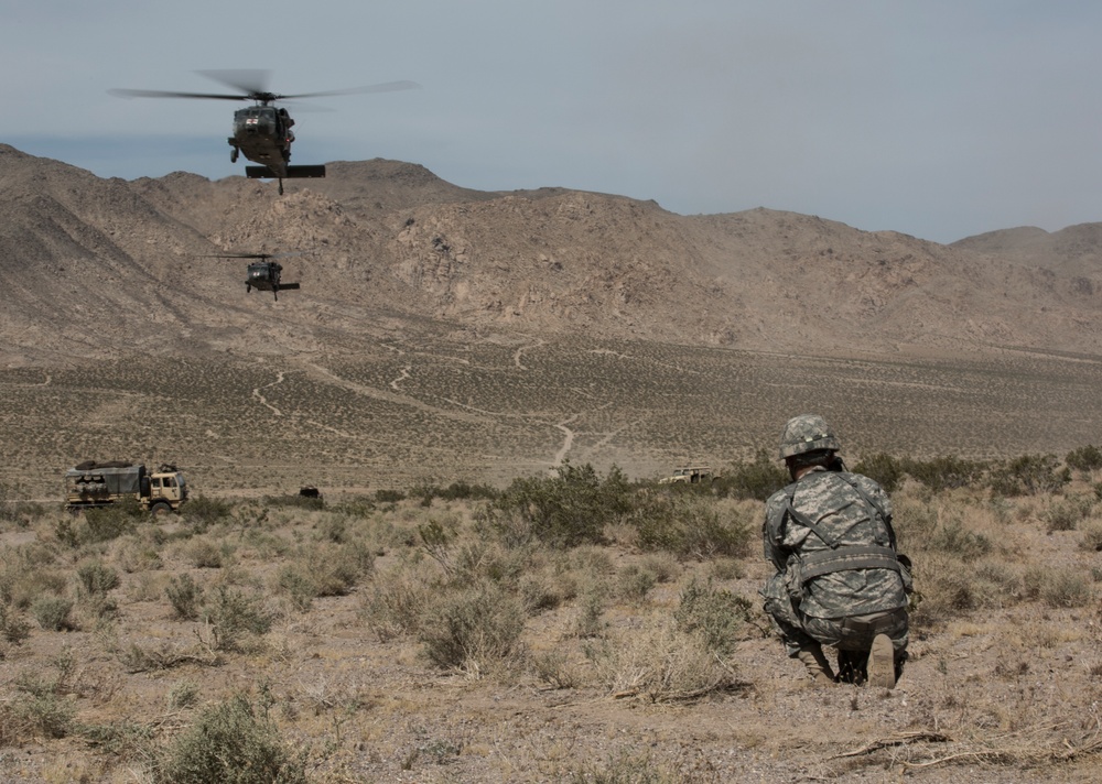 Soldiers engage enemy targets with howitzer