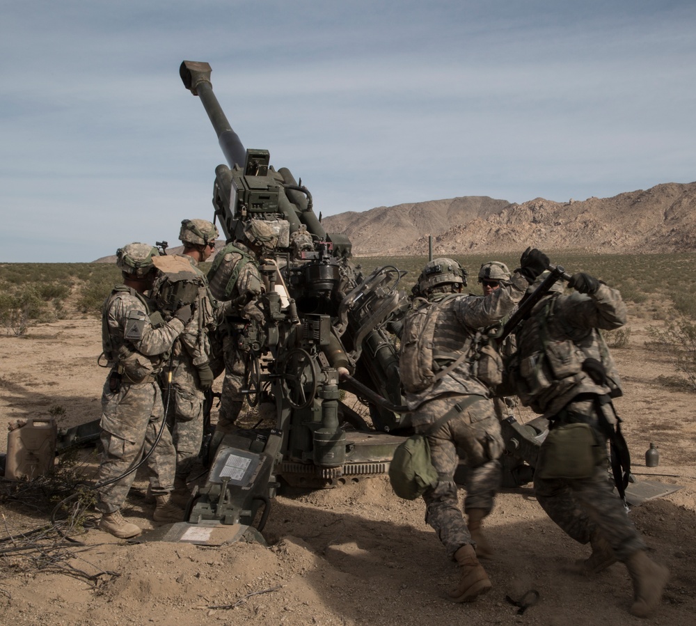 Soldiers rapidly engage enemies with M777 howitzer