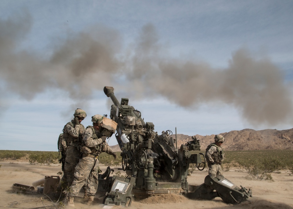 Soldiers rapidly engage enemies with M777 howitzer