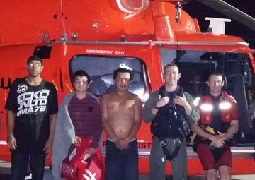 Coast Guard rescues 2 men, 1 child from sinking boat