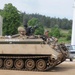 OPFOR armored personnel carrier rumbles into town