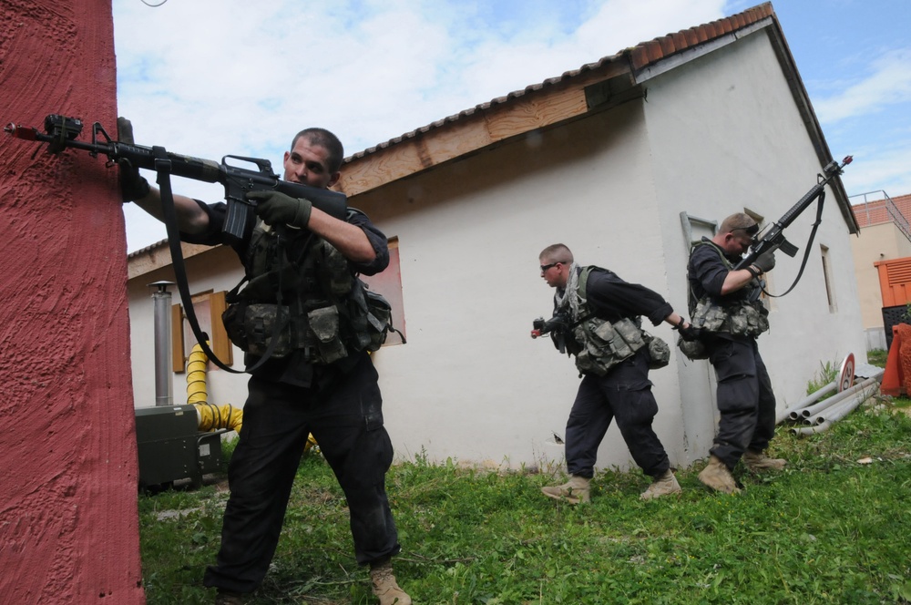 OPFOR provides security moving through a town