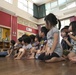 3rd Recon Marines teach Nago children, sneak learning into games