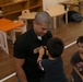 3rd Recon Marines teach Nago children, sneak learning into games