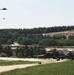 Austrian helicopter flies over to Apaches doing sling-load