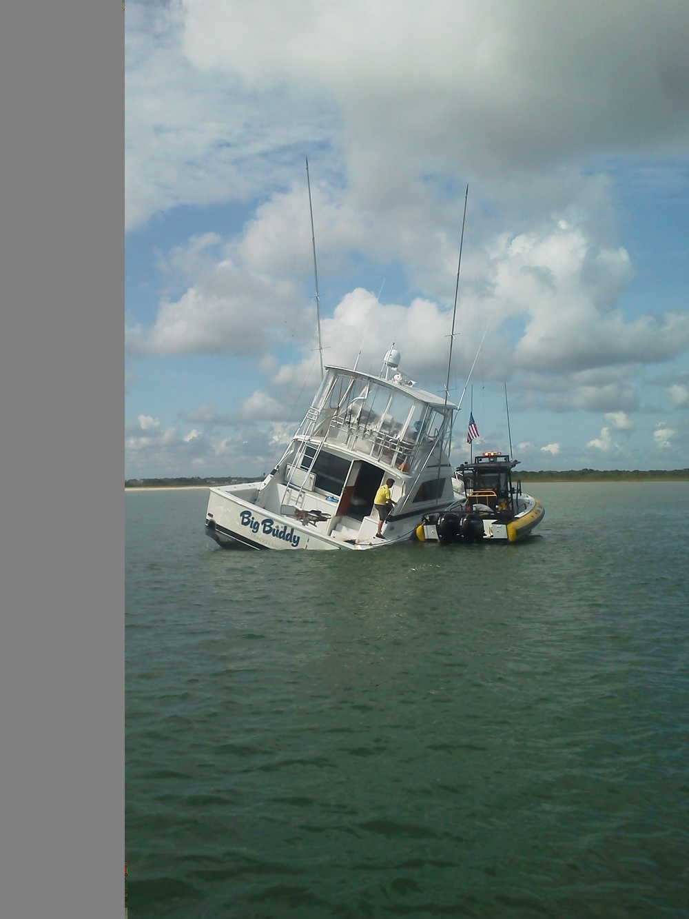 Coast Guard assists grounded, flooding boat with 7 people aboard