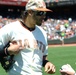 Petty Officer 1st Class Daniell Lashbrook receives an autograph from San Francisco Giants player Michael Morse on Memorial Day