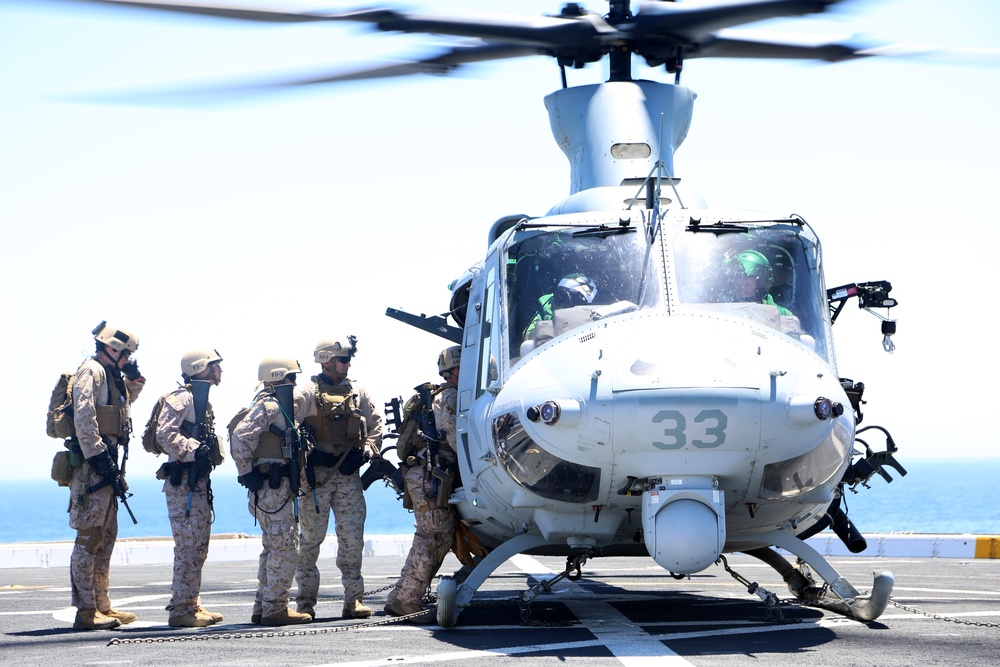 Force Reconnaissance Detachment fast ropes onto the USS San Diego