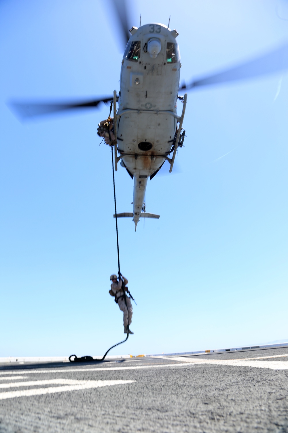 Force Reconnaissance Detachment fast ropes onto the USS San Diego