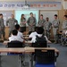 Teach thy neighbor: Middle school Students learn English from Soldiers