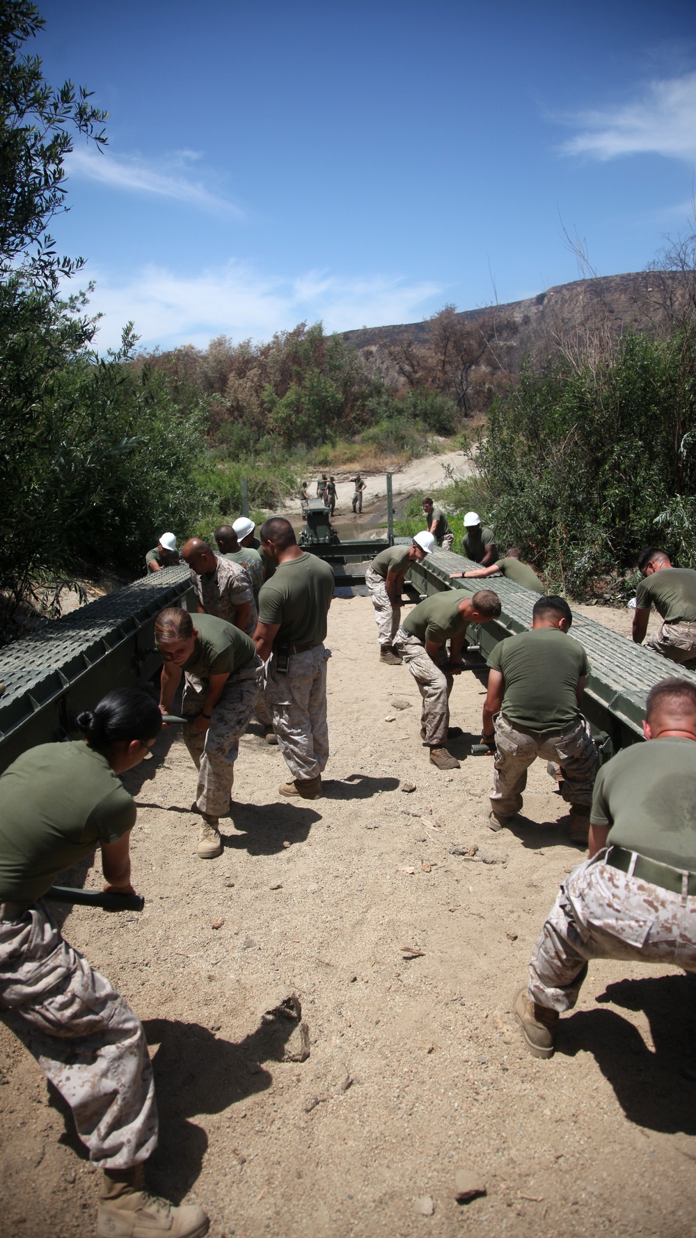 Combat engineers build bridge over muddy water for World Famous Mud Run