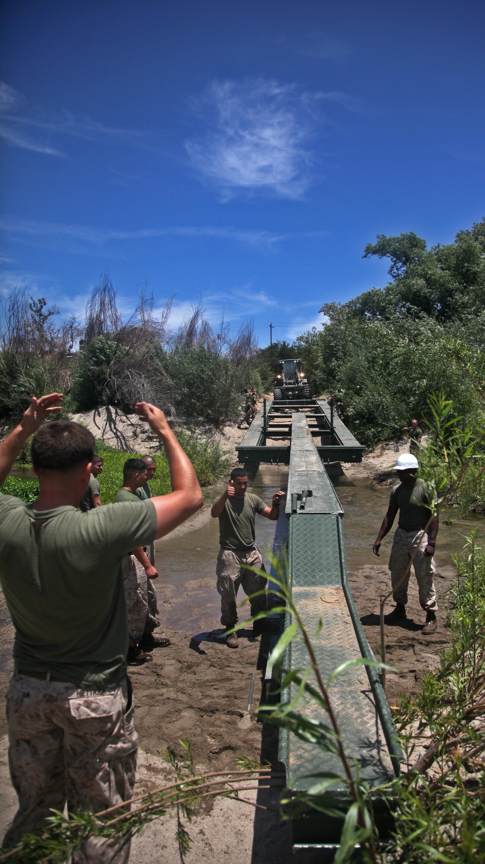 Combat engineers build bridge over muddy water for World Famous Mud Run