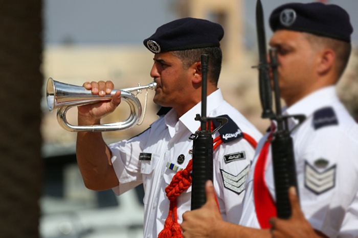 Jordanian honor guard bugler sounds attention at Eager Lion 2014