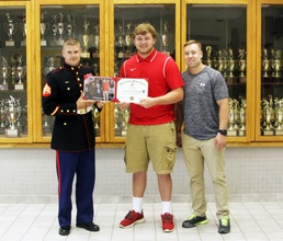 Chancellor High School senior receives US Marine Corps football certificate