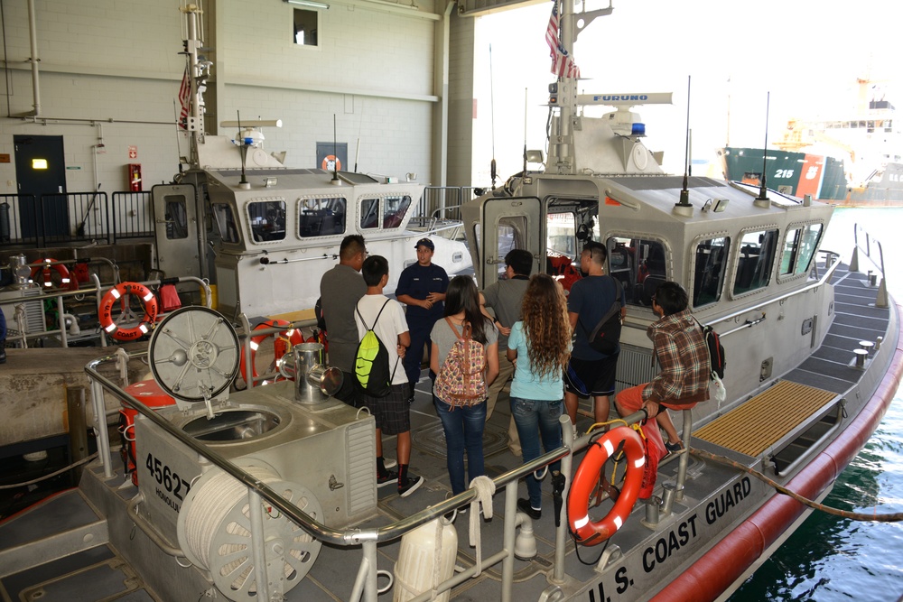 Students learn about search and rescue aboard a  Coast Guard response boat