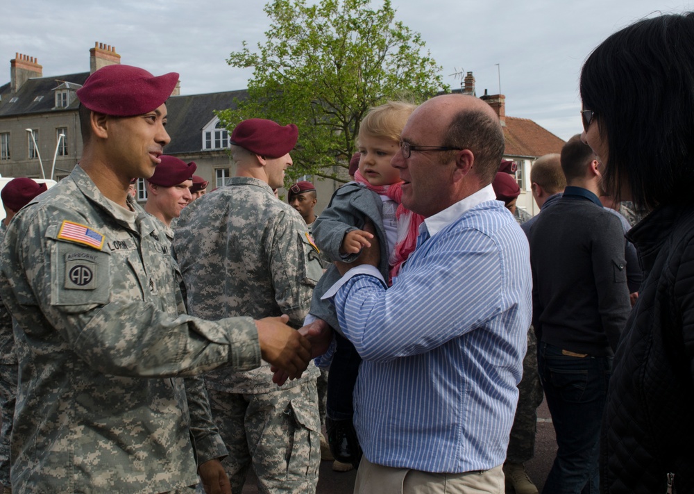 French families host American Soldiers during Normandy commemoration.