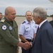 US Secretary of Defense Chuck Hagel (right) greets Romanian Air Force Col. Adrian Vasile