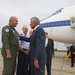 US Secretary of Defense Chuck Hagel (right) greets Romanian Air Force Col. Adrian Vasile