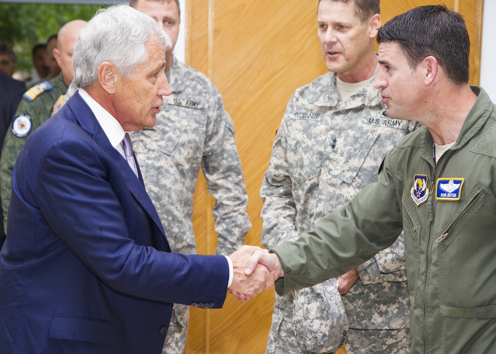 US Secretary of Defense Chuck Hagel greets US Air Force Col. Robert L. Dotson