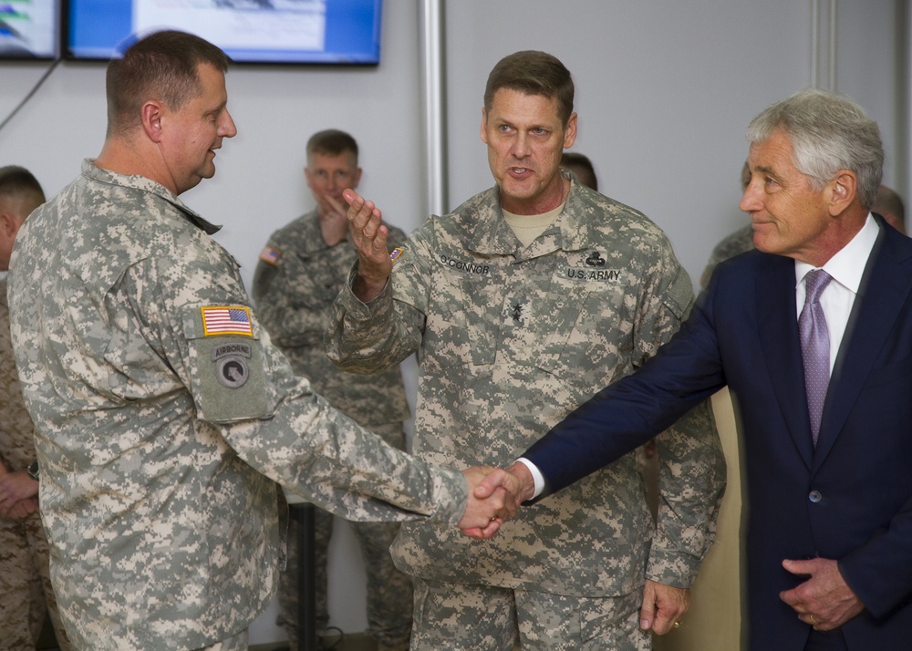 US Secretary of Defense Chuck Hagel and Maj. Gen. John O'Connor, commanding general of US Army Europe’s 21st Theater Sustainment Command, greet Col. Chris Brookie