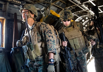 Marines jump off of Super Stallions for parachute operations