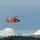 Coast Guard MH-65 Dolphin helicopter crew arrives at Spruce Cape near Kodiak, Alaska