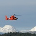 Coast Guard MH-65 Dolphin helicopter crew arrives at Spruce Cape near Kodiak, Alaska