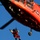 Coast Guard MH-65 Dolphin helicopter crew conducts vertical surface training hoist operation in Kodiak, Alaska