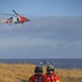 Coast Guard aviation survival technicians prepare for vertical surface training in Kodiak, Alaska