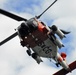 Coast Guard MH-60 Jayhawk helicopter crew takes off from Air Station Kodiak, Alaska