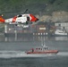Coast Guard MH-60 Jayhawk helicopter crew conducts a hoist demonstration in Kodiak, Alaska