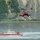 Coast Guard MH-60 Jayhawk helicopter crew conducts a hoist demonstration in Kodiak, Alaska