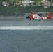 Coast Guard MH-60 Jayhawk helicopter crew deploys an aviation survival technician in Kodiak, Alaska