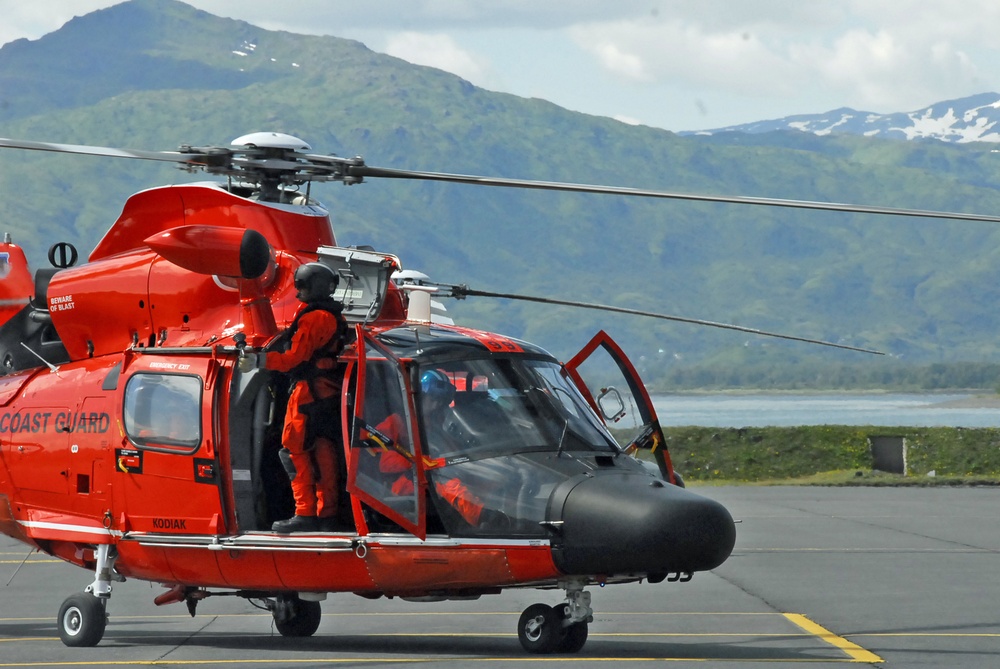 Coast Guard MH-65 Dolphin helicopter crew prepares for takeoff at Air Station Kodiak, Alaska