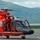 Coast Guard MH-65 Dolphin helicopter crew prepares for takeoff at Air Station Kodiak, Alaska