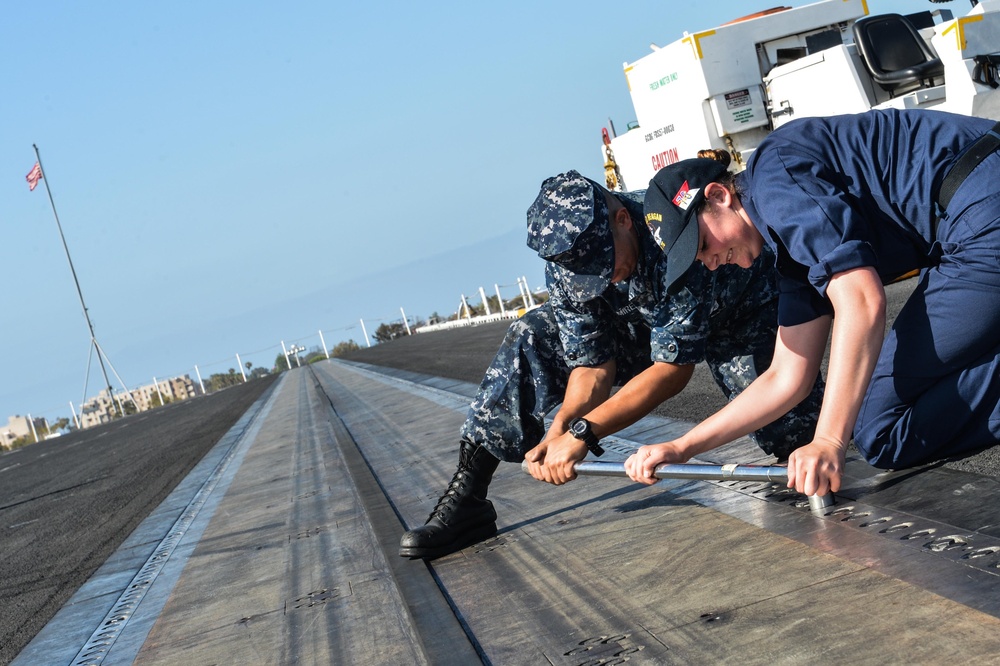 USS Ronald Reagan sailors tighten bolts