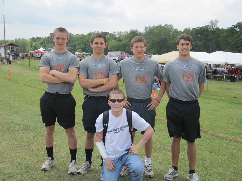 The Carpenter brothers compete in a mud race in Cpl. Kyle Carpenter's honor