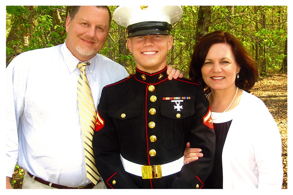 Lance Cpl. Kyle Carpenter with parents, Jim and Robin Carpenter.