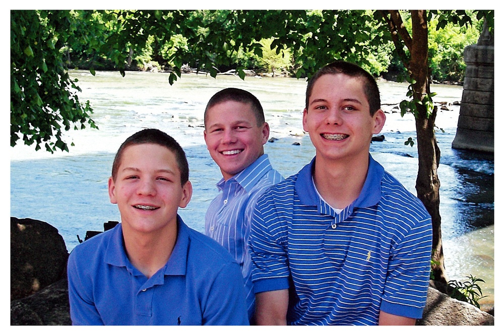 Kyle Carpenter poses with his twin brothers, Peyton and Price