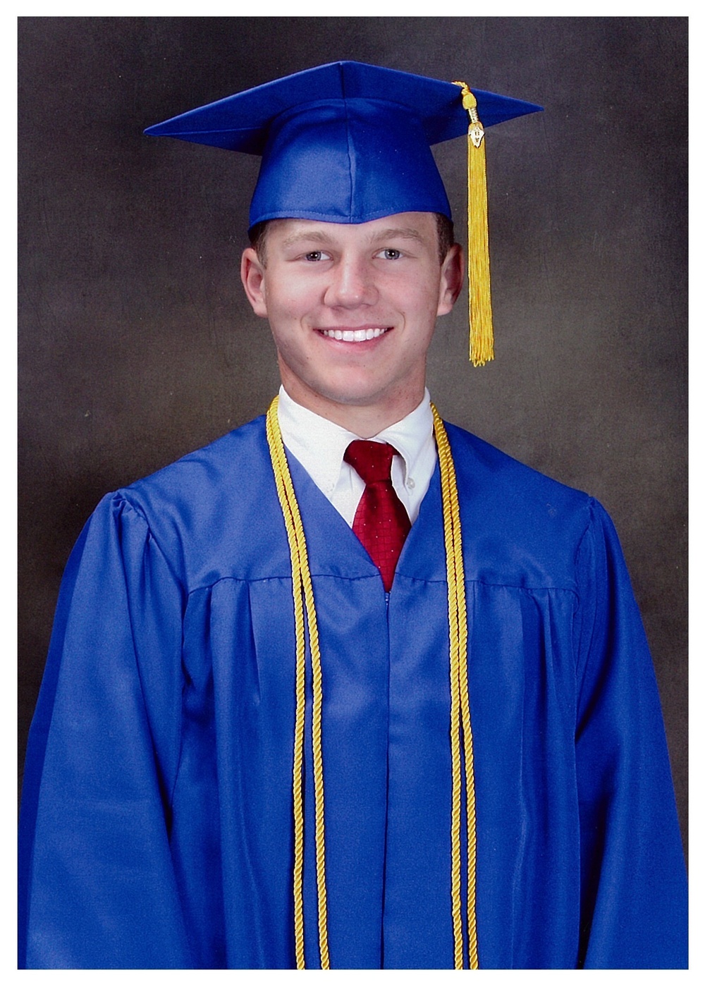 Kyle Carpenter poses for an official W. Wyman King High School graduation photograph