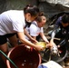 Soldiers give affection and attention to abandoned animals