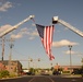 A US flag is draped between the ladder of Stafford Volunteer Fire Department’s Truck Company 2