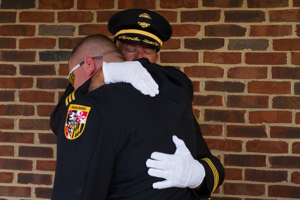 A firefighter comforts a co-worker