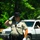 A Stafford County, Virginia, deputy sheriff temporarily closing a roadway, salutes the funeral procession
