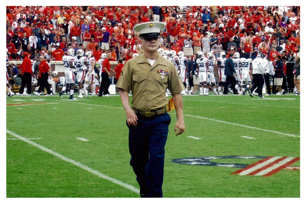 Lance Cpl. Kyle Carpenter walking off the field during the Semper Fi All-American Bowl