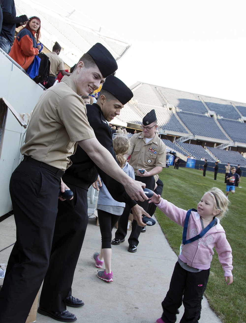 FHCC Sailors present finishing medals at Soldier Field 10 Mile