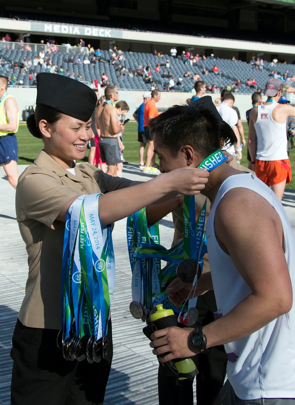 FHCC Sailors present finishing medals at Soldier Field 10 Mile