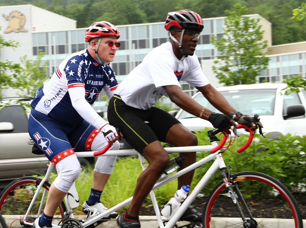 Staff Sgt. Sean Johnson (retired) practices cycling for the 2014 Army Warrior Trials with Sgt. 1st Class, Brian Mathis, Warrior Transition Unit cadre