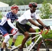 Staff Sgt. Sean Johnson (retired) practices cycling for the 2014 Army Warrior Trials with Sgt. 1st Class, Brian Mathis, Warrior Transition Unit cadre