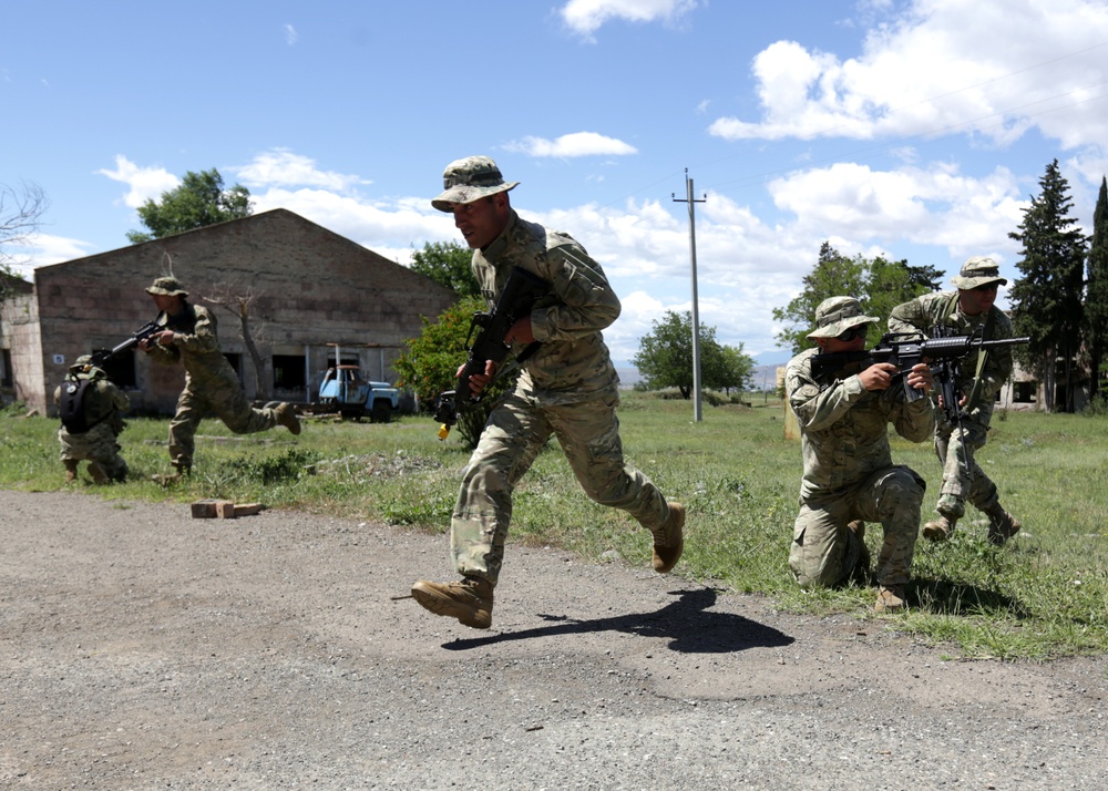 Marines and sailors of BSRF perform tatical movements during Agile Spirit 14